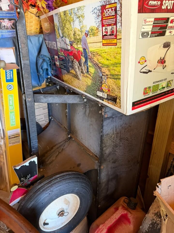 Garage items including a spreader and wheel