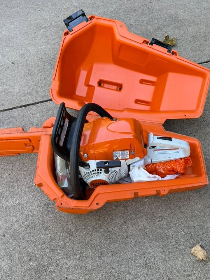 Chainsaw in its orange carry case